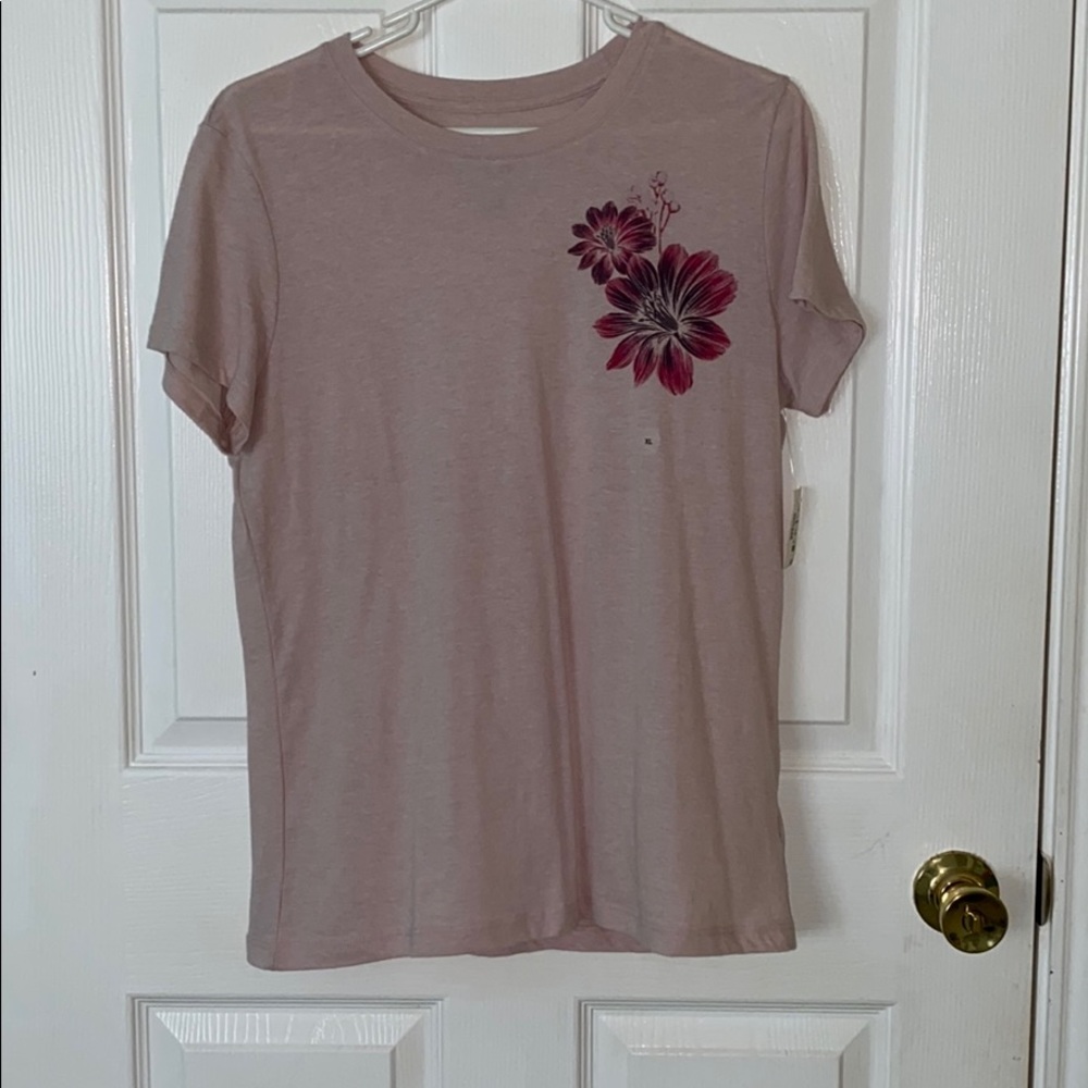 pink shirt w dark pink flowers.